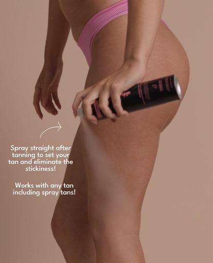 Model applying the setting spray on her body